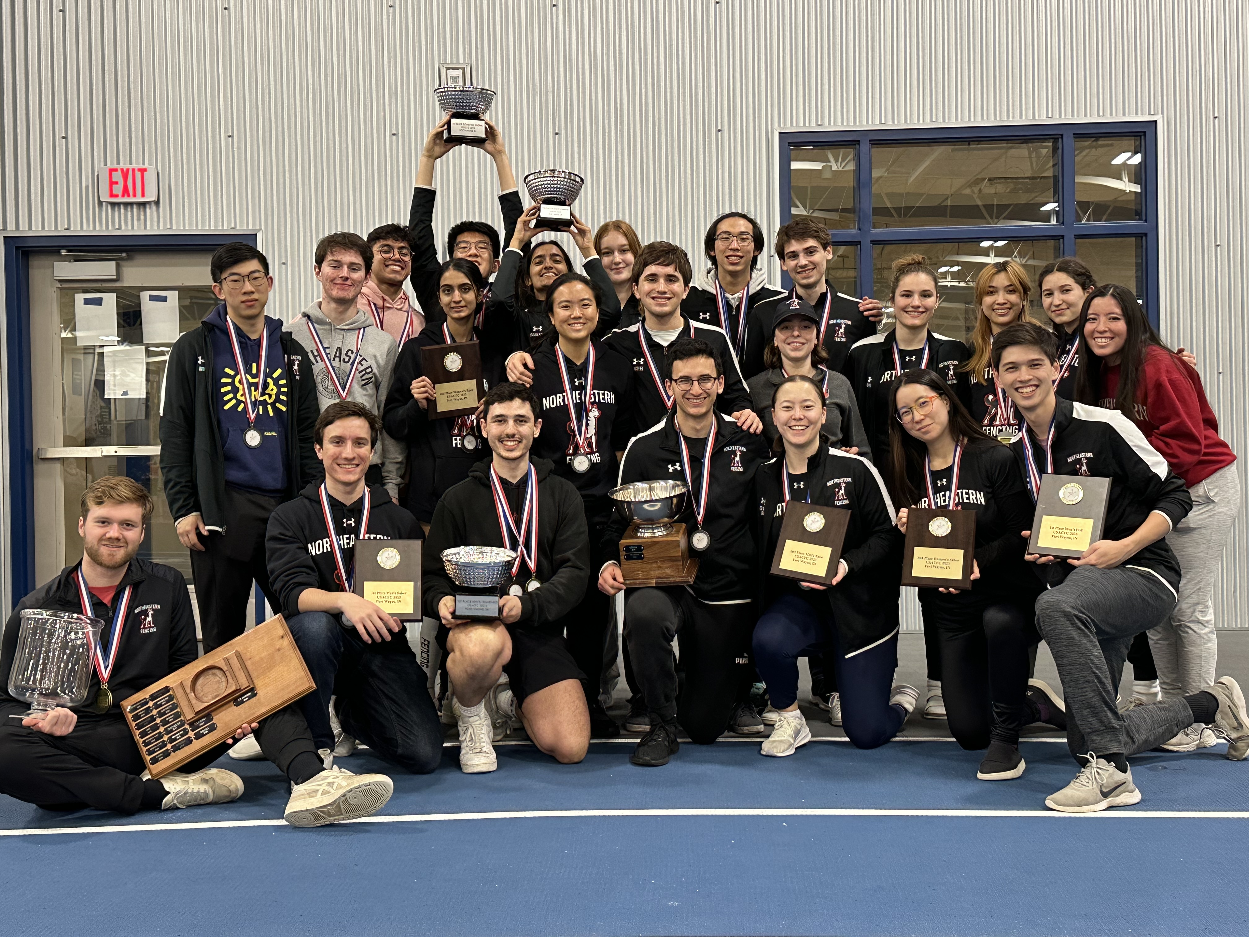 NEU entire team photo with medals after winning 2023 club nationals